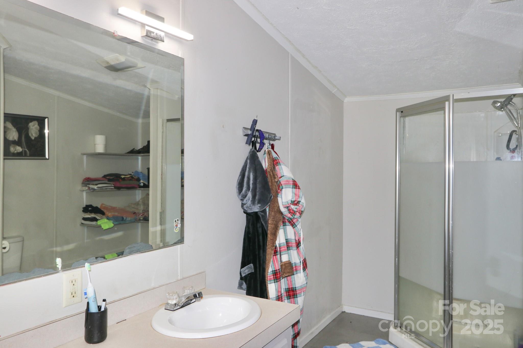 112 Courtney Road Mocksville, NC 27028 - Photo 14 of 31 a bathroom with a sink a toilet and shower