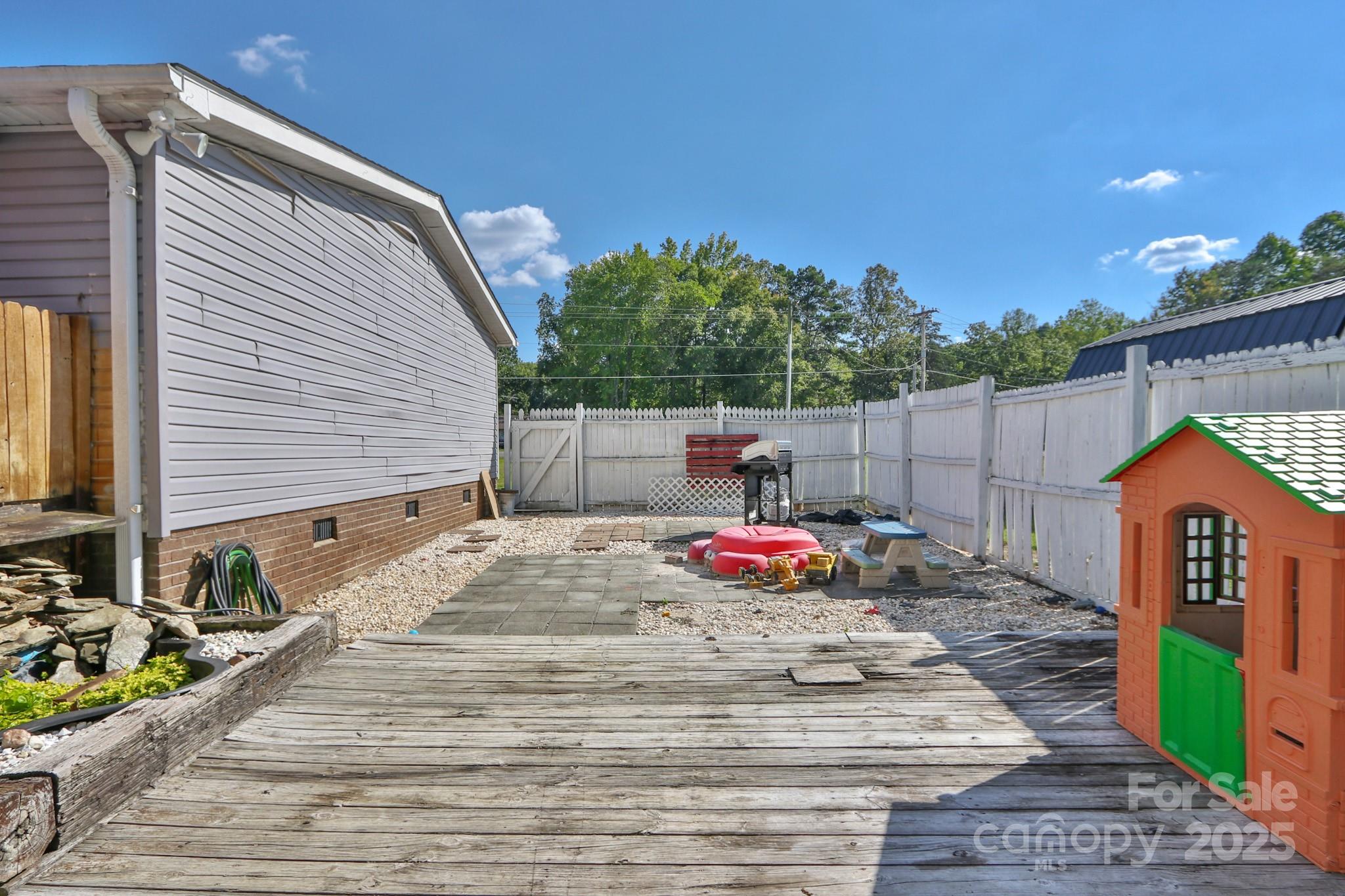 112 Courtney Road Mocksville, NC 27028 - Photo 25 of 31 a backyard of a house with seating space
