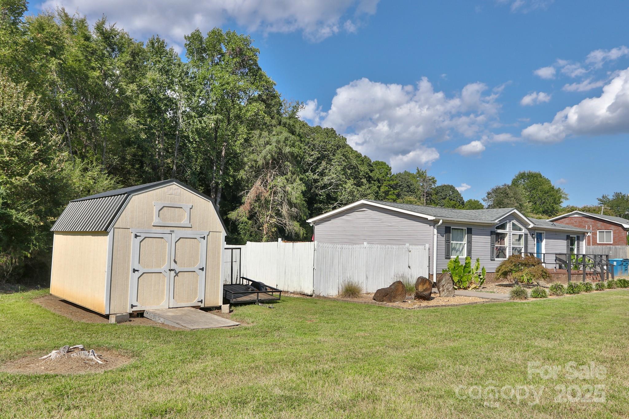 112 Courtney Road Mocksville, NC 27028 - Photo 29 of 31 a view of a house with a yard