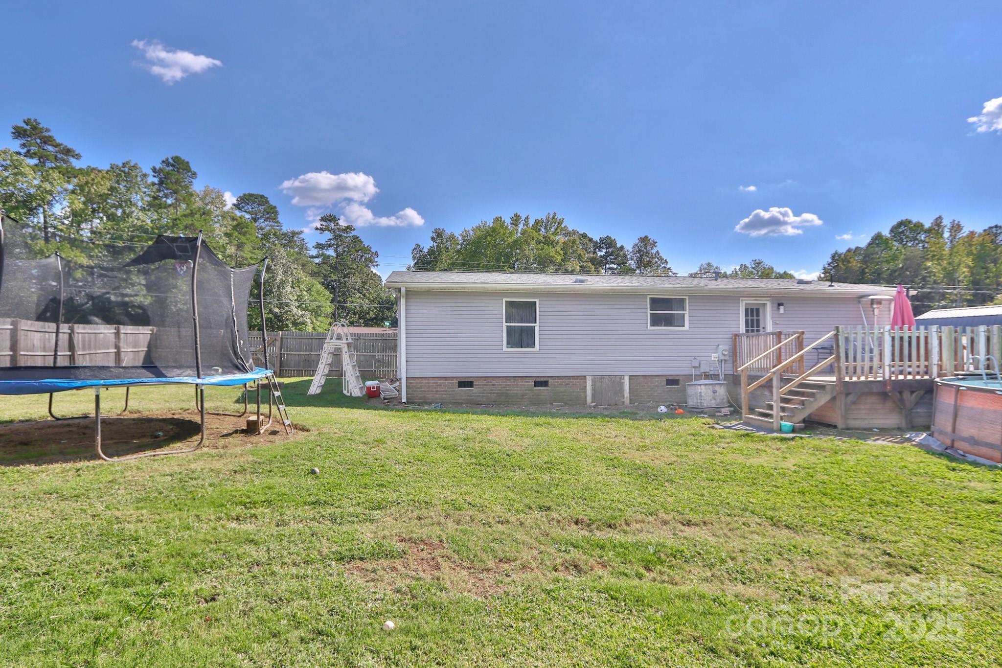 112 Courtney Road Mocksville, NC 27028 - Photo 3 of 31 a backyard of a house with table and chairs