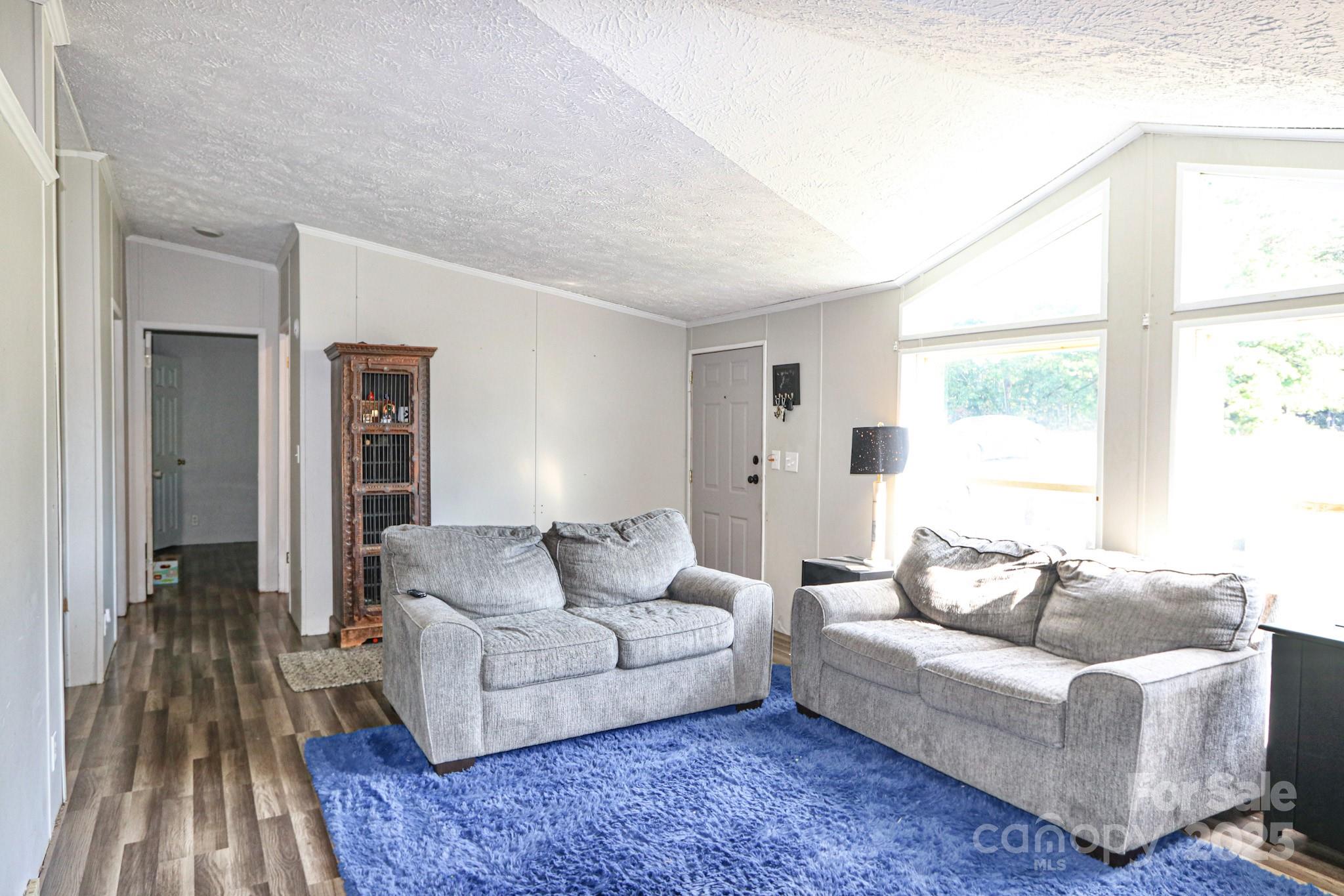 112 Courtney Road Mocksville, NC 27028 - Photo 8 of 31 a living room with furniture and a window