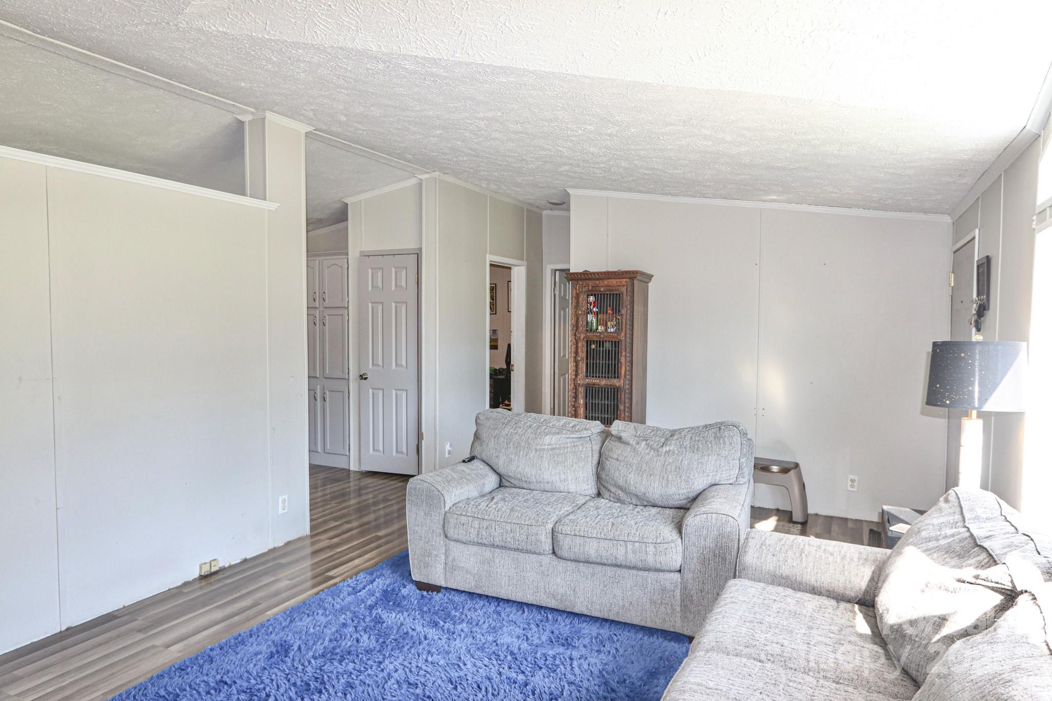 112 Courtney Road Mocksville, NC 27028 - Photo 9 of 31 a living room with furniture and a lamp