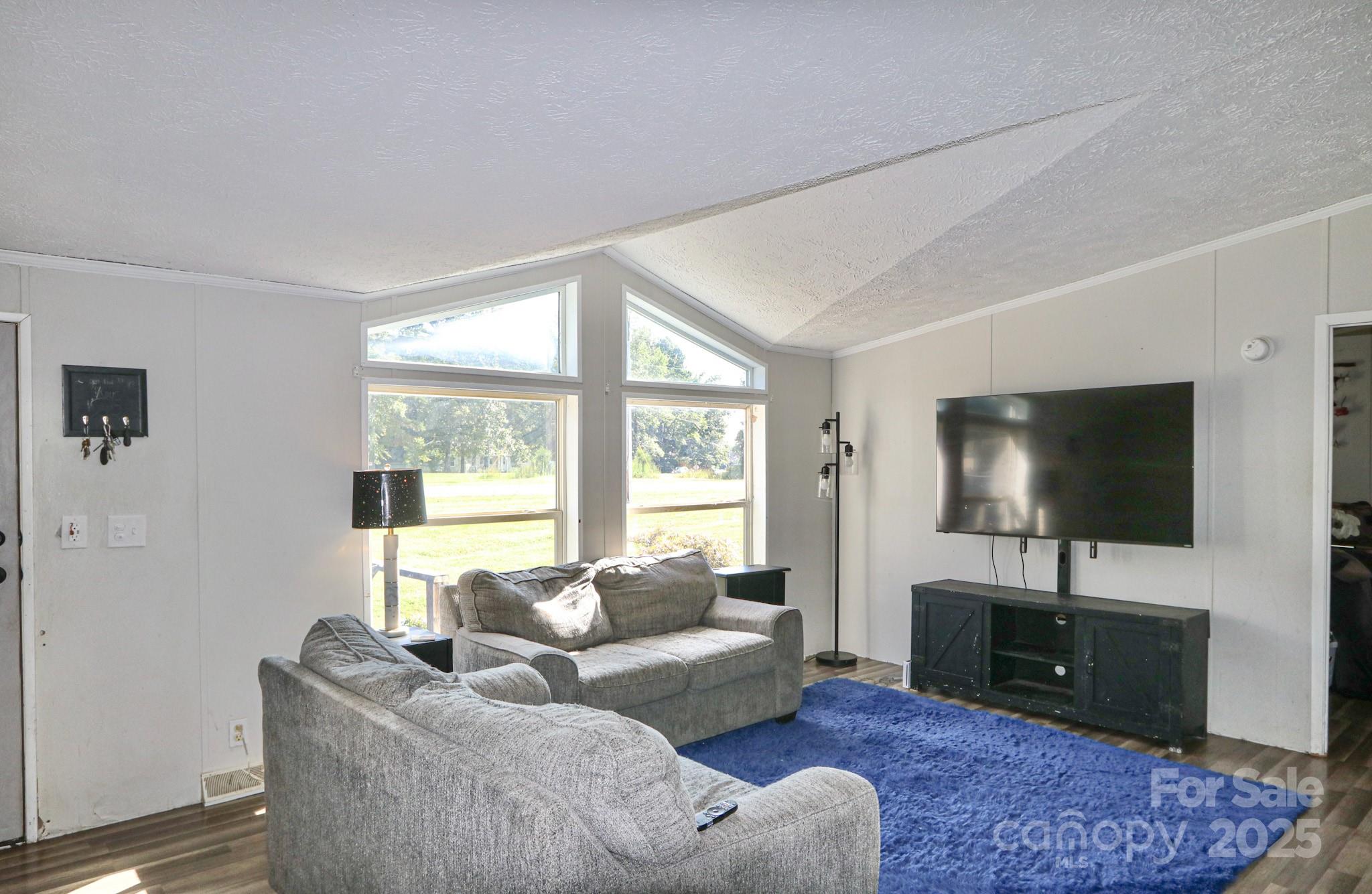 112 Courtney Road Mocksville, NC 27028 - Photo 10 of 31 a living room with furniture and a flat screen tv