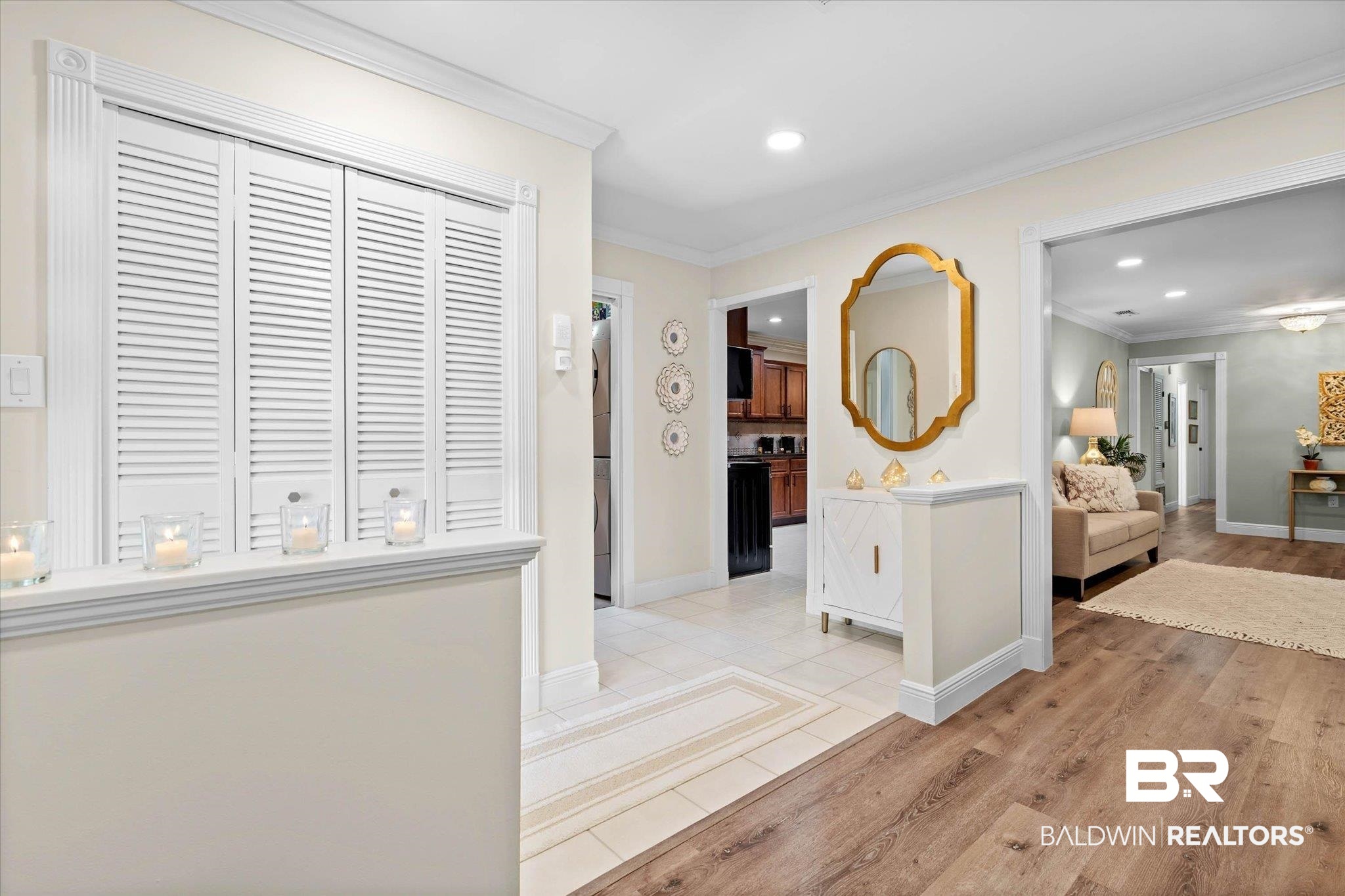 101 Ann Street Daphne, AL 36527 - Photo 9 of 38 Entryway featuring wood-finish flooring, white tile flooring, and white louvered bifold doors