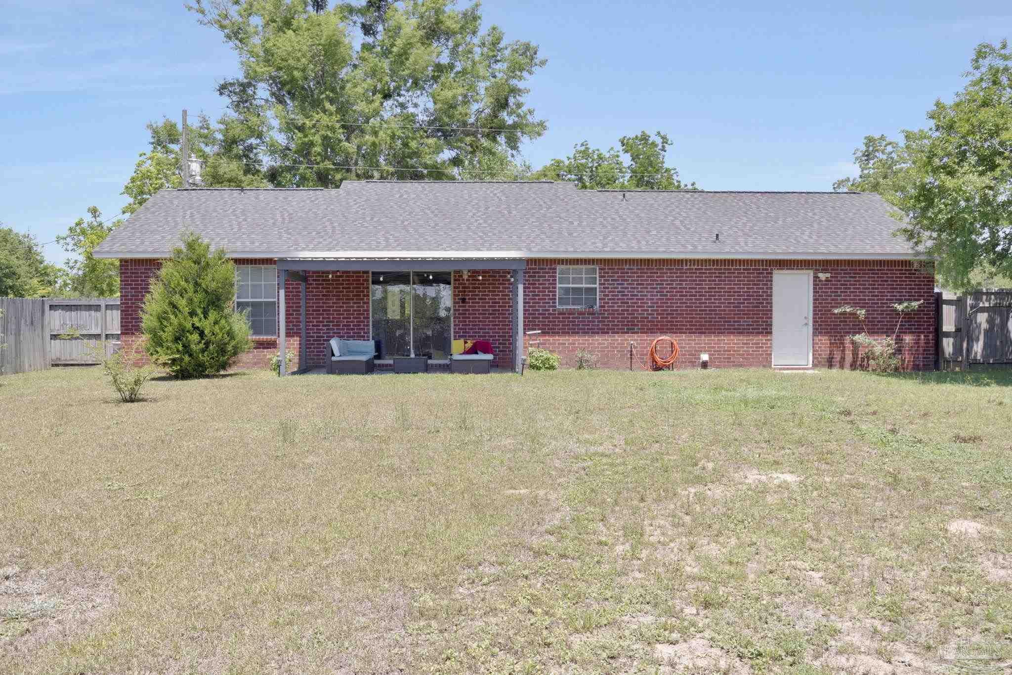 5539 Windrun Place Pace, FL 32571 - Photo 44 of 62 front view of a house with a yard