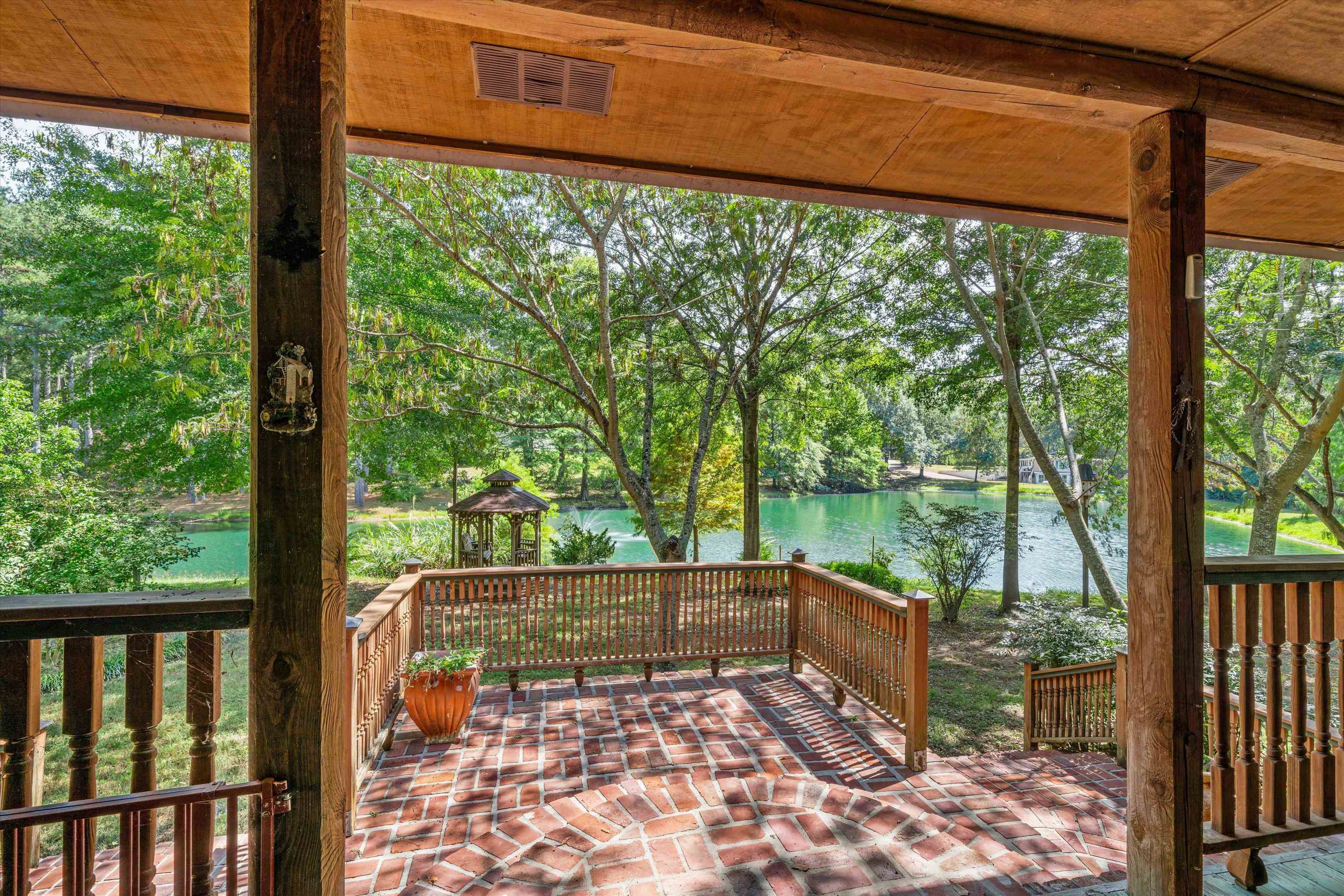 245 Metro Road Eads, TN 38028 - Photo 1 of 33 Front covered deck a water view, a patio area, and a gazebo