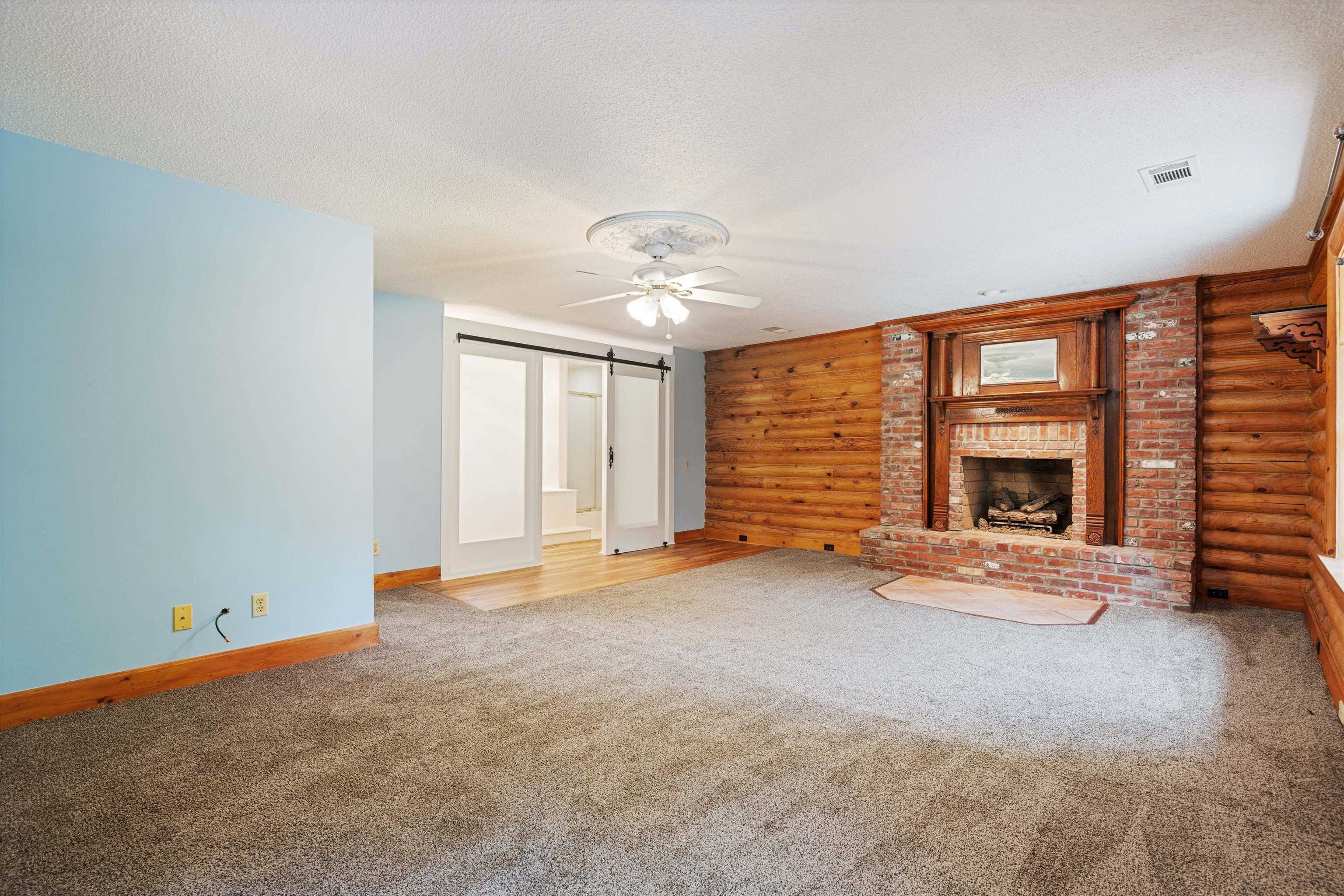 245 Metro Road Eads, TN 38028 - Photo 13 of 33 Primary bedroom with a brick fireplace