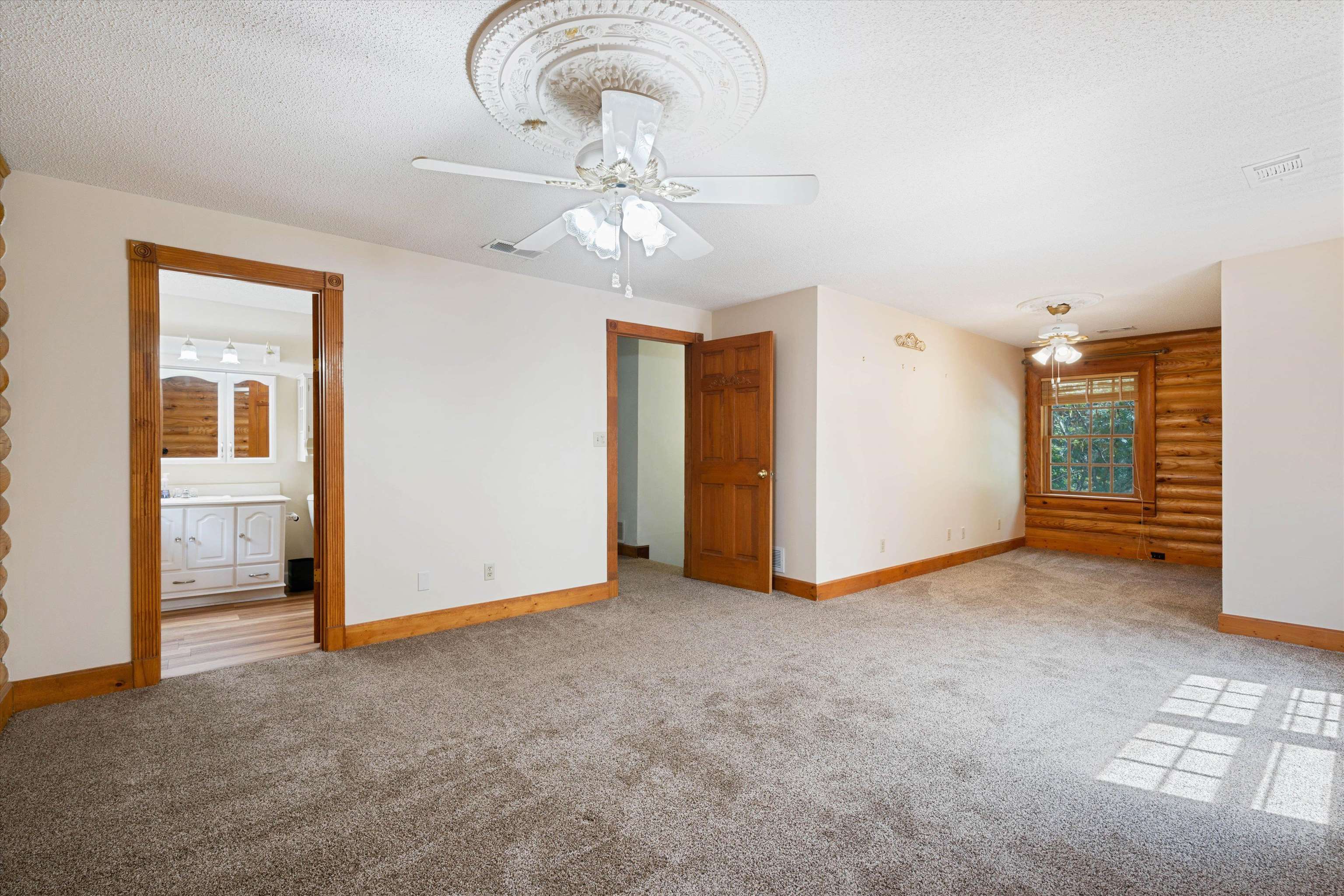 245 Metro Road Eads, TN 38028 - Photo 24 of 33 Interior space featuring a textured ceiling, ceiling fan, and wooden walls