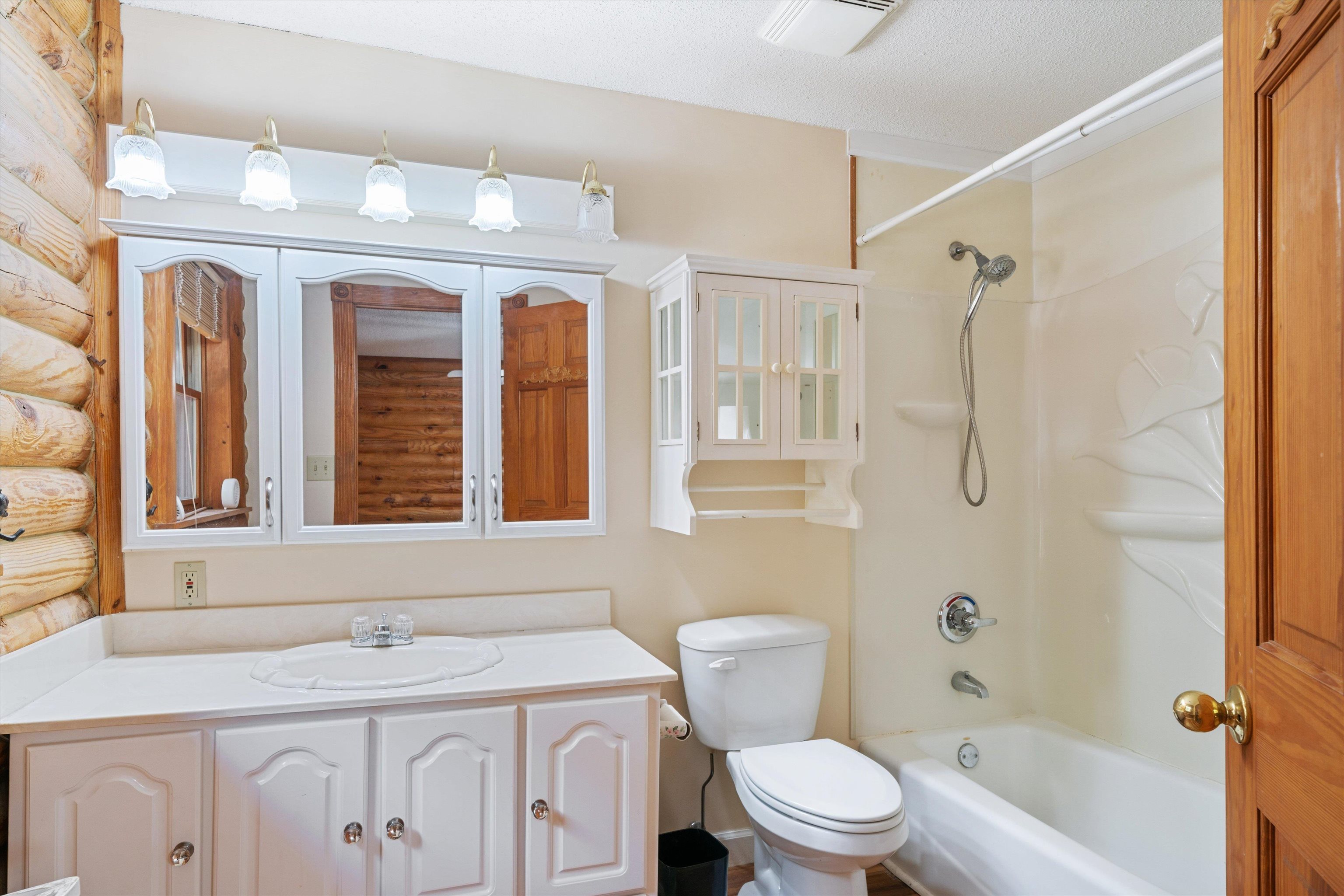 245 Metro Road Eads, TN 38028 - Photo 25 of 33 Full bathroom with a textured ceiling, vanity, toilet, and tub / shower combination