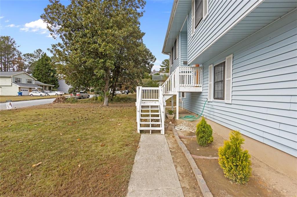 5865 Vernier Drive Southwest Atlanta, GA 30349 - Photo 2 of 33 a front view of a house with a ocean view