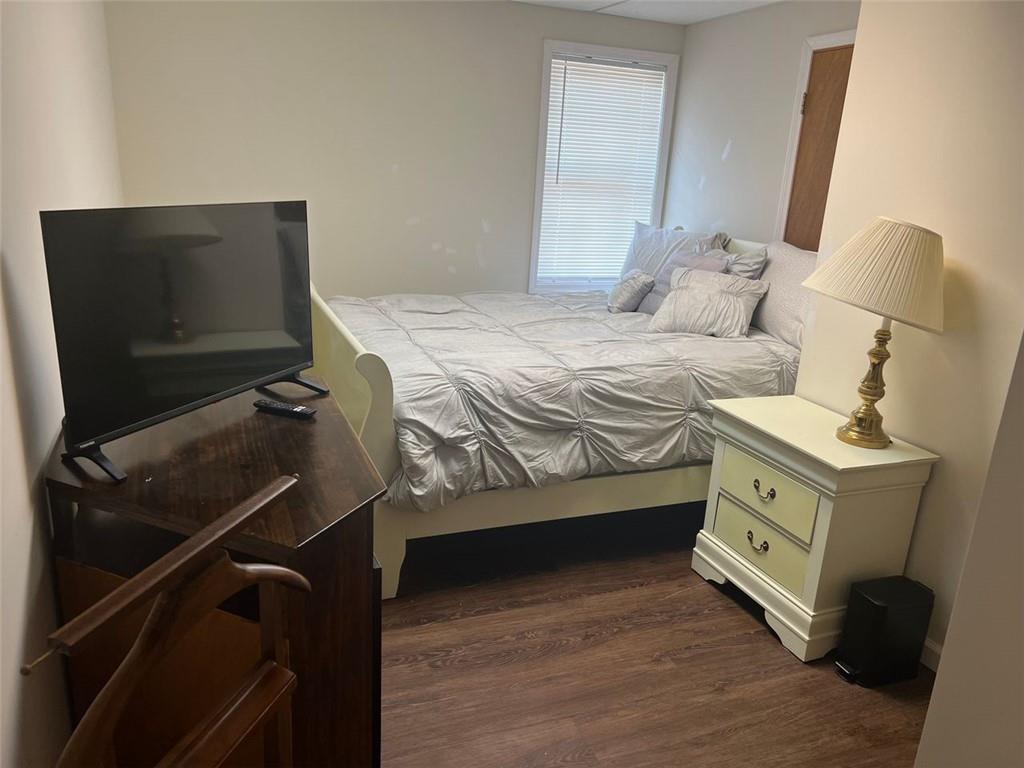 5865 Vernier Drive Southwest Atlanta, GA 30349 - Photo 28 of 33 a bedroom with a bed and a mirror