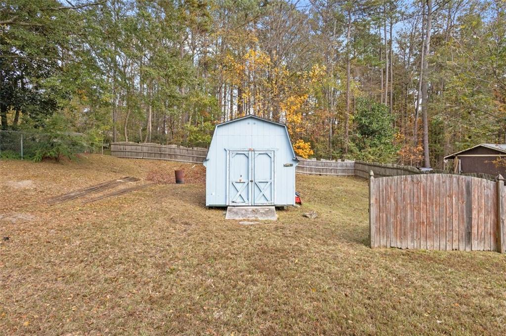 5865 Vernier Drive Southwest Atlanta, GA 30349 - Photo 32 of 33 a view of a backyard with tree s