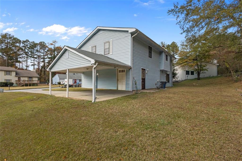 5865 Vernier Drive Southwest Atlanta, GA 30349 - Photo 33 of 33 a view of a house with a backyard
