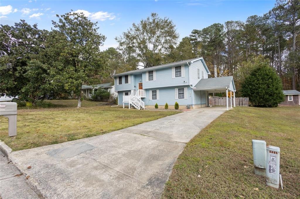 5865 Vernier Drive Southwest Atlanta, GA 30349 - Photo 4 of 33 a view of a house with a yard