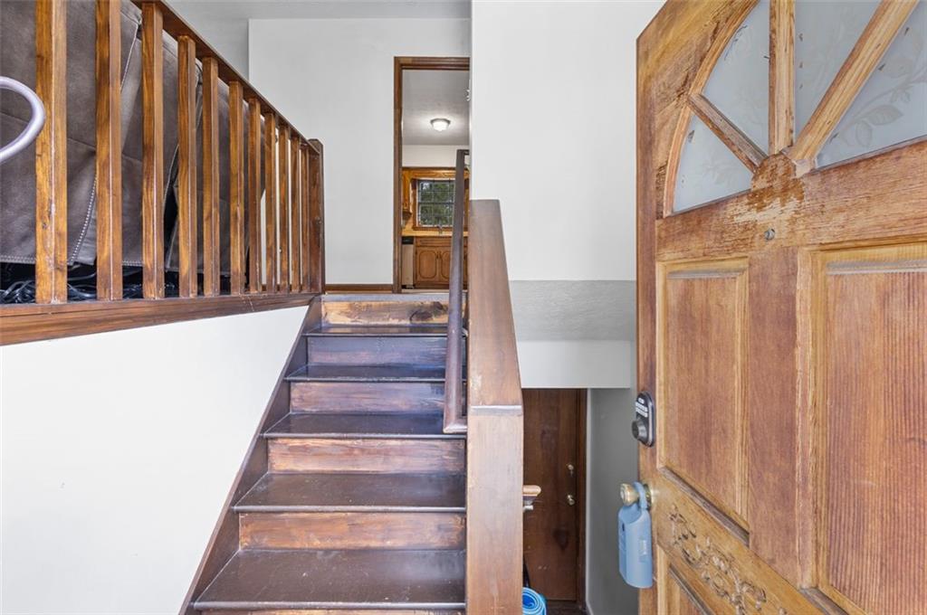 5865 Vernier Drive Southwest Atlanta, GA 30349 - Photo 5 of 33 a view of staircase with white walls and a window