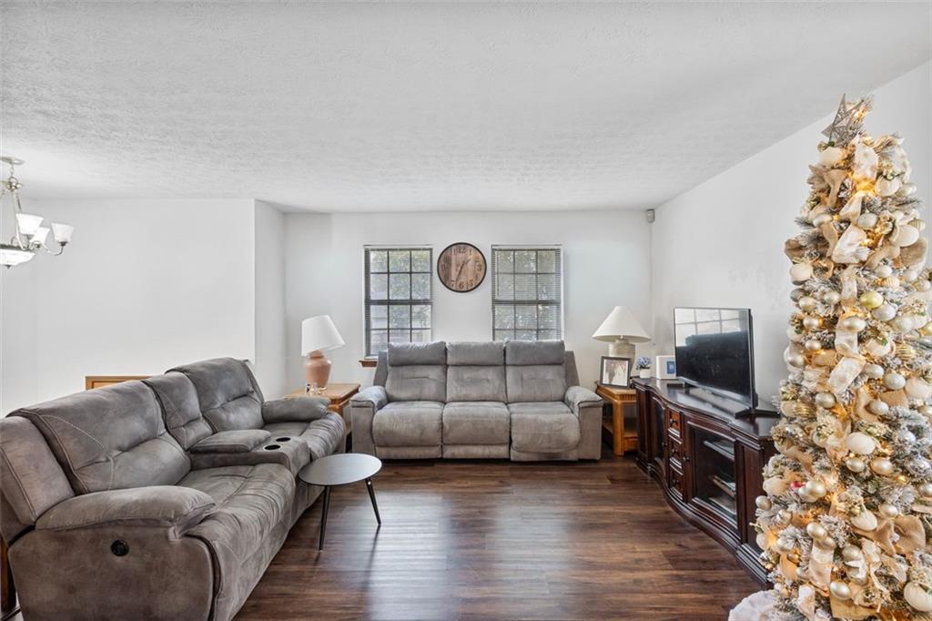 5865 Vernier Drive Southwest Atlanta, GA 30349 - Photo 7 of 33 a living room with furniture and a flat screen tv