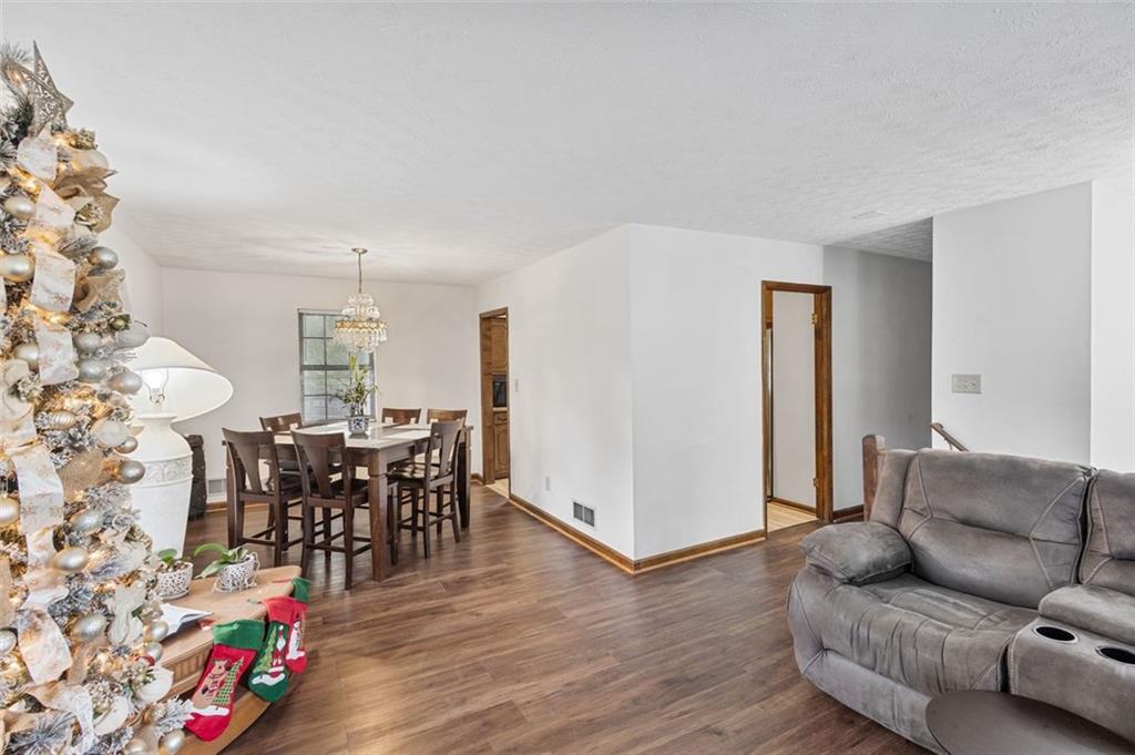 5865 Vernier Drive Southwest Atlanta, GA 30349 - Photo 8 of 33 a living room with furniture and wooden floor