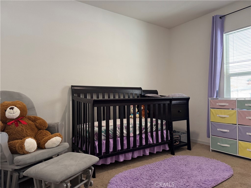 657 Lebec Road, Unit 36 Lebec, CA 93243 - Photo 14 of 20 a bedroom with furniture and a chair