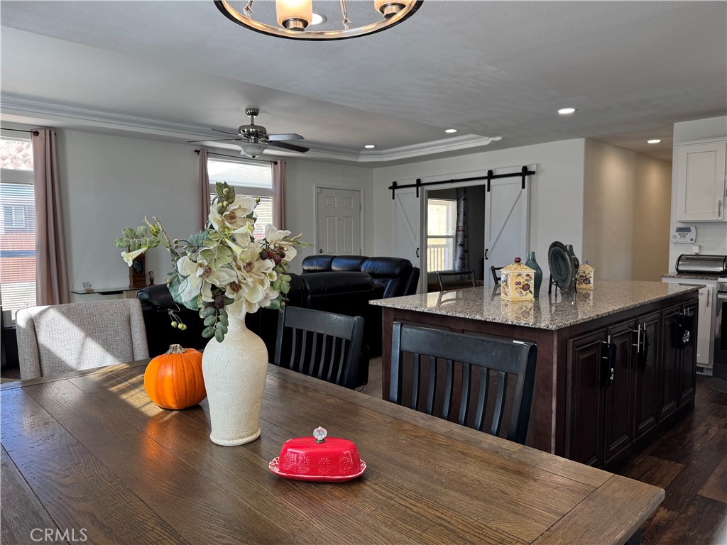 657 Lebec Road, Unit 36 Lebec, CA 93243 - Photo 8 of 20 a kitchen with stainless steel appliances kitchen island granite countertop a cabinets and wooden floor