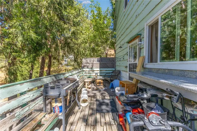 a view of balcony with furniture and garden