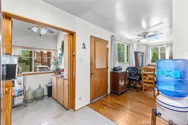 a view of a livingroom with furniture and windows