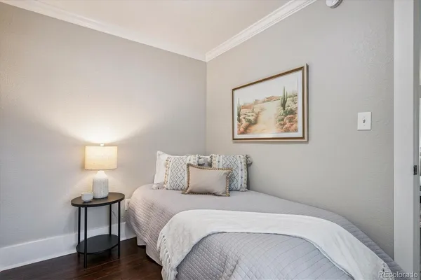 a bedroom with a bed and a lamp