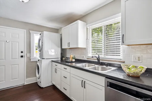 a kitchen with a sink and cabinets