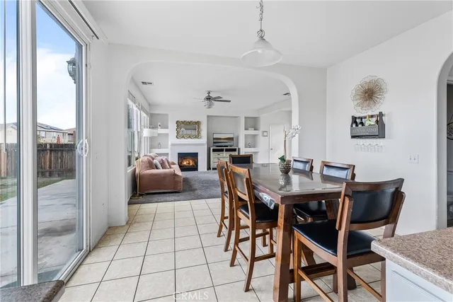 a view of a dining room with furniture and a rug