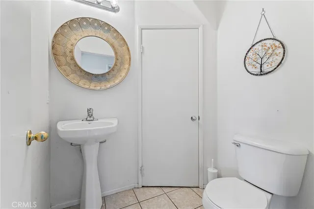 a bathroom with a toilet and a sink