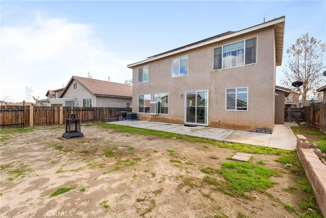 a house view with a backyard space