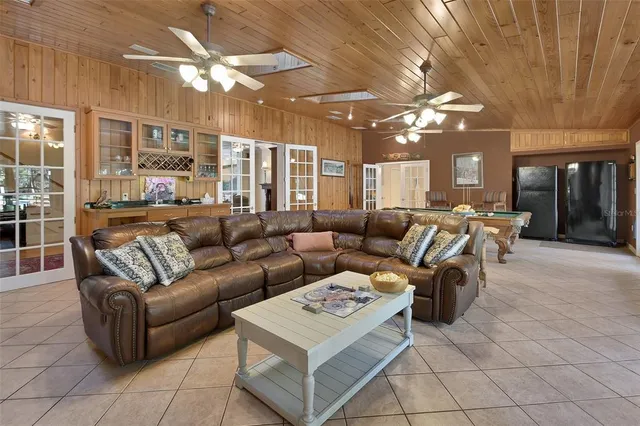 a kitchen with stainless steel appliances granite countertop a sink and a refrigerator