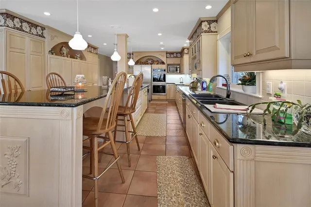a kitchen with sink cabinets and window