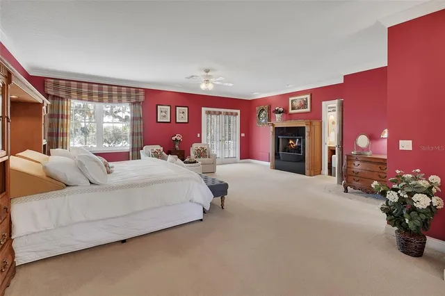 a room with a bed and a television