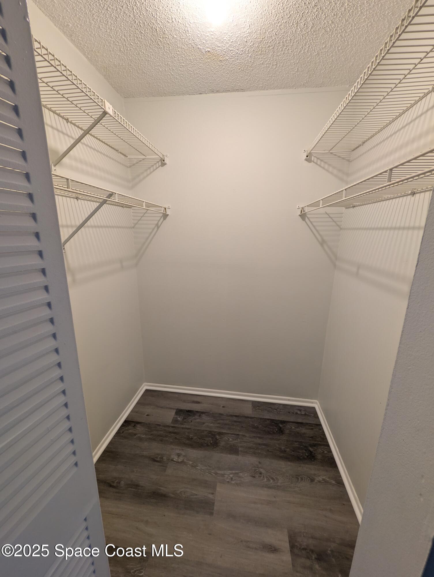 4801 Sisson Road Titusville, FL 32780 - Photo 12 of 21 a view of a room with racks on the wall