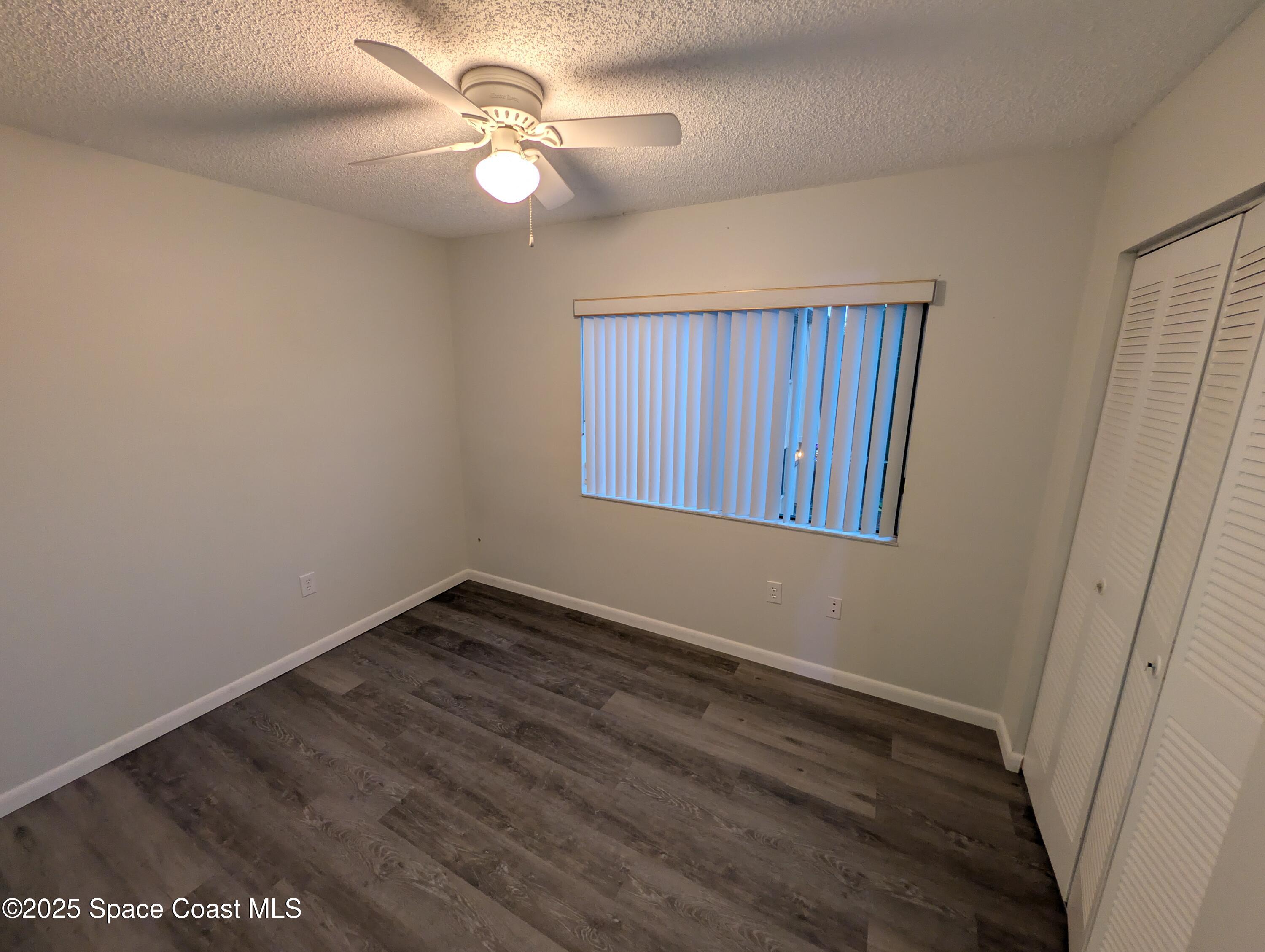 4801 Sisson Road Titusville, FL 32780 - Photo 13 of 21 a view of an empty room with a window