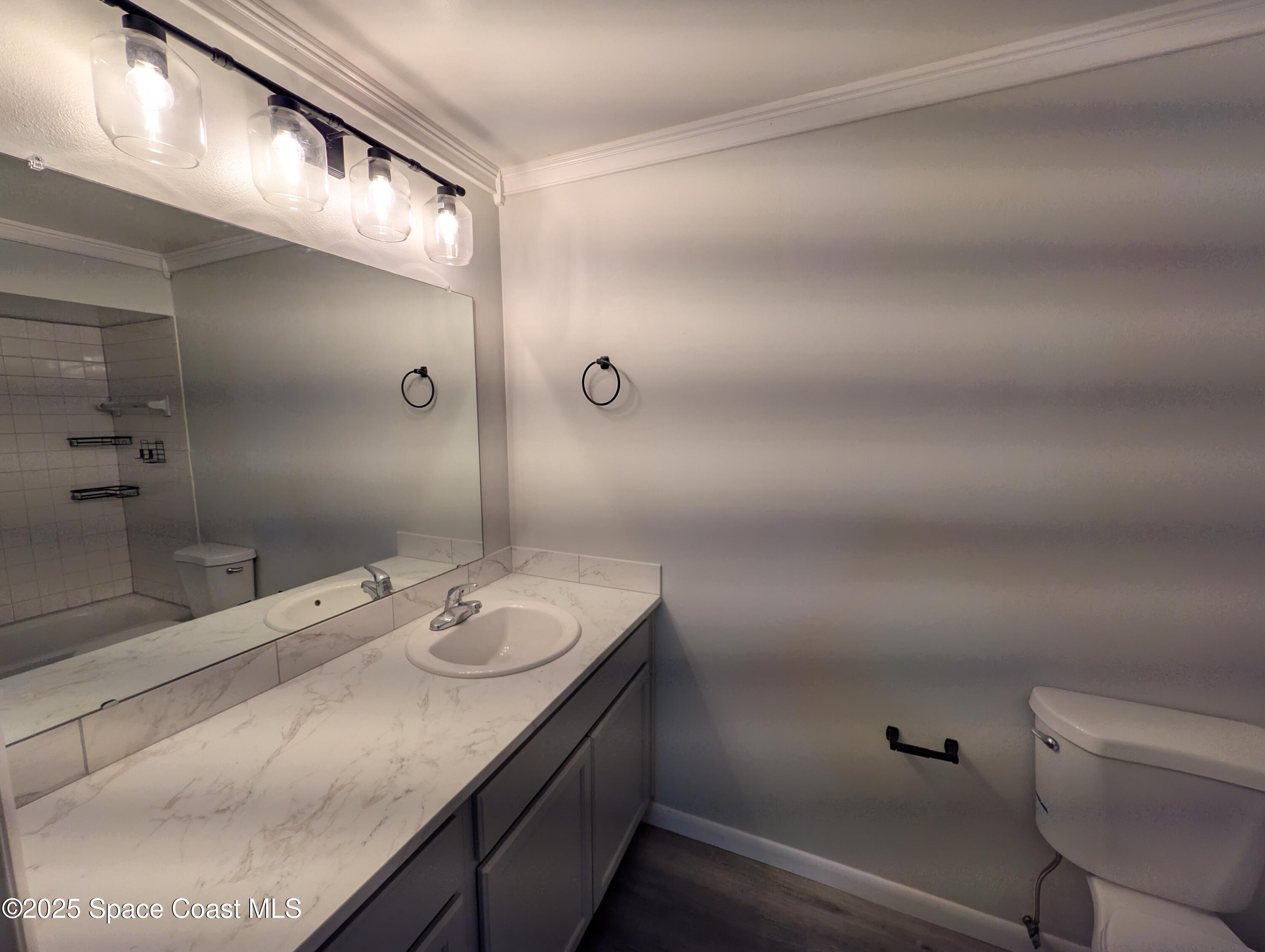 4801 Sisson Road Titusville, FL 32780 - Photo 15 of 21 a bathroom with a granite countertop sink and a mirror