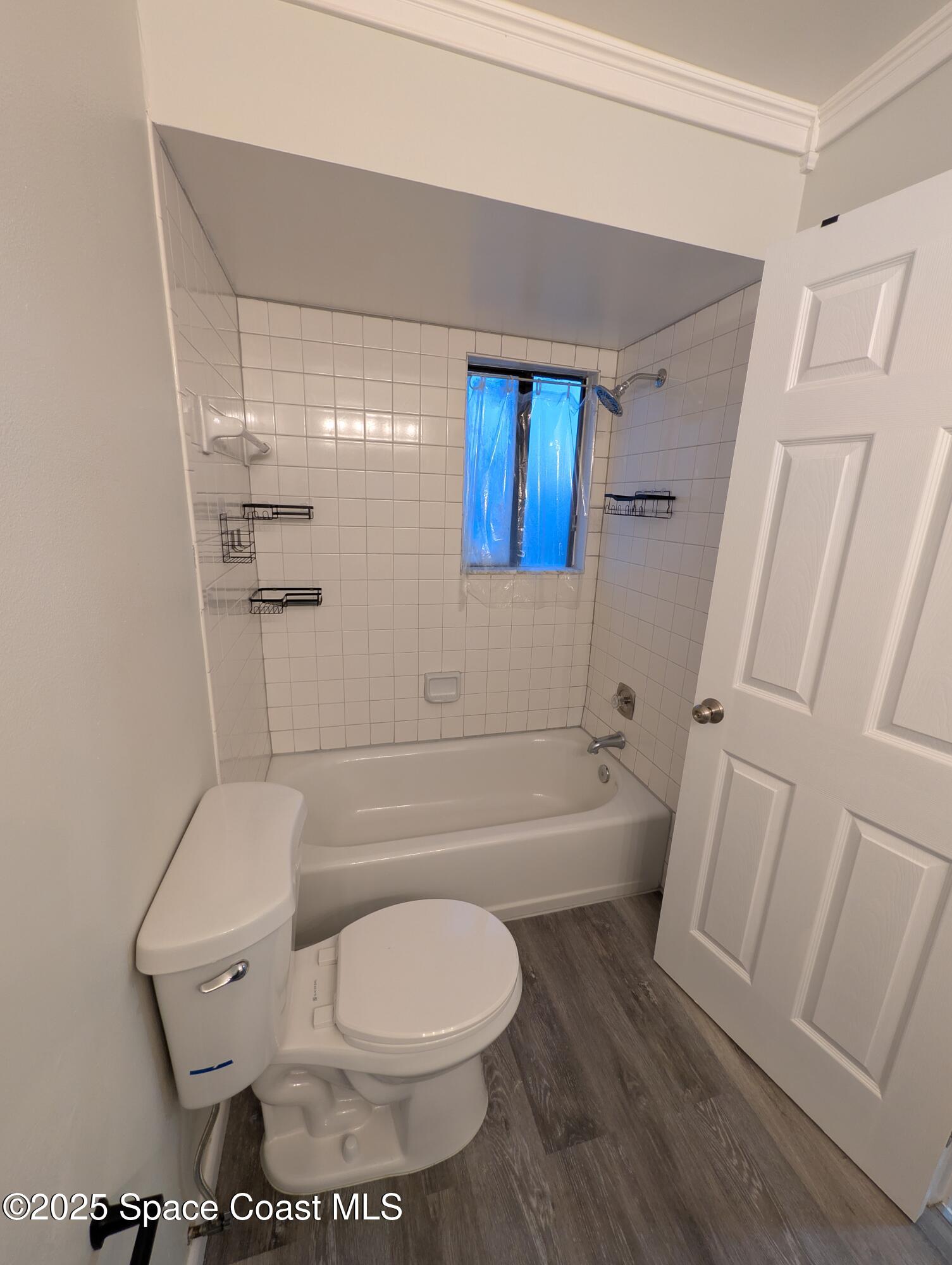 4801 Sisson Road Titusville, FL 32780 - Photo 16 of 21 a bathroom with a toilet and a shower