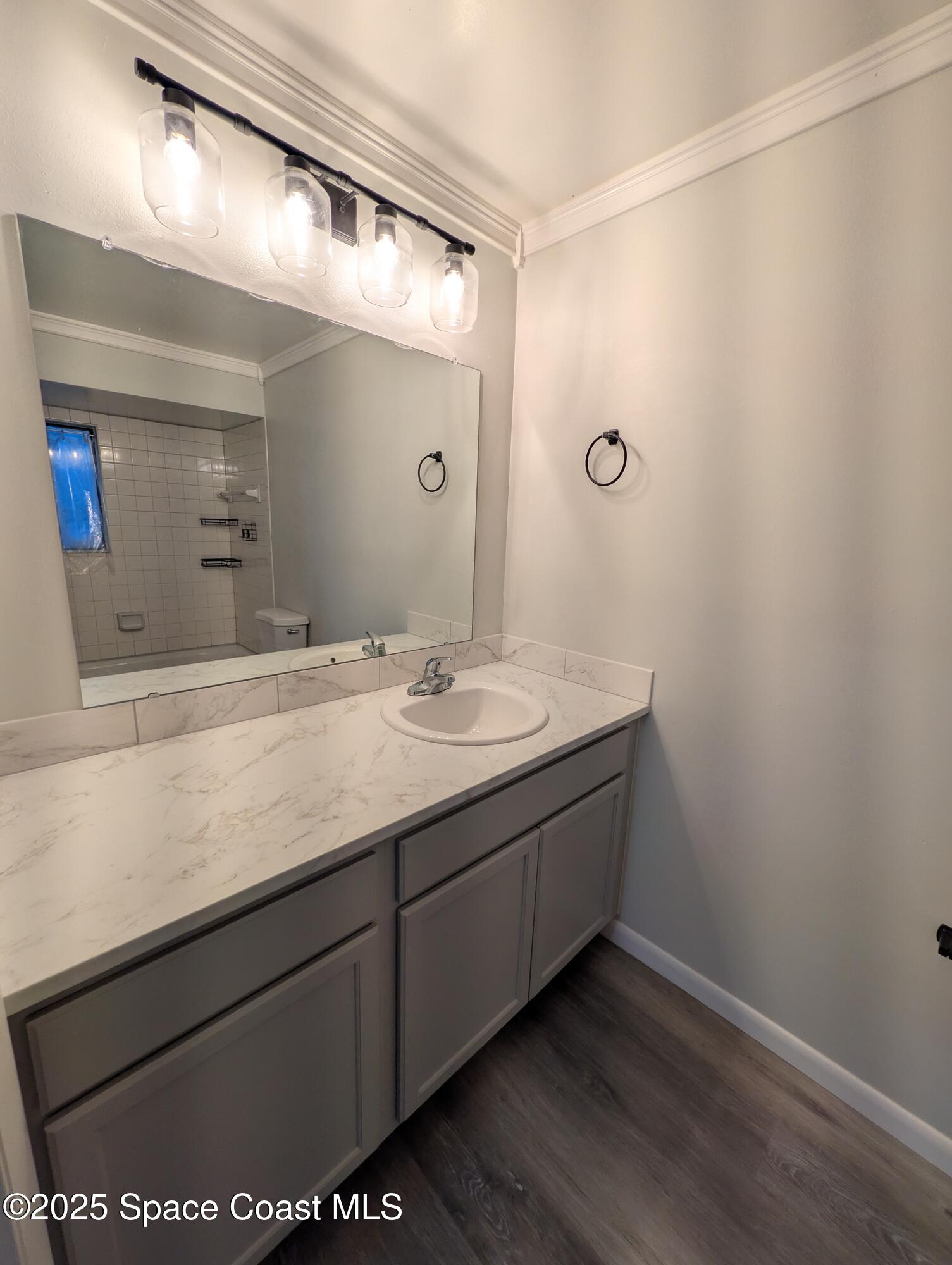4801 Sisson Road Titusville, FL 32780 - Photo 17 of 21 a bathroom with a granite countertop sink and a mirror