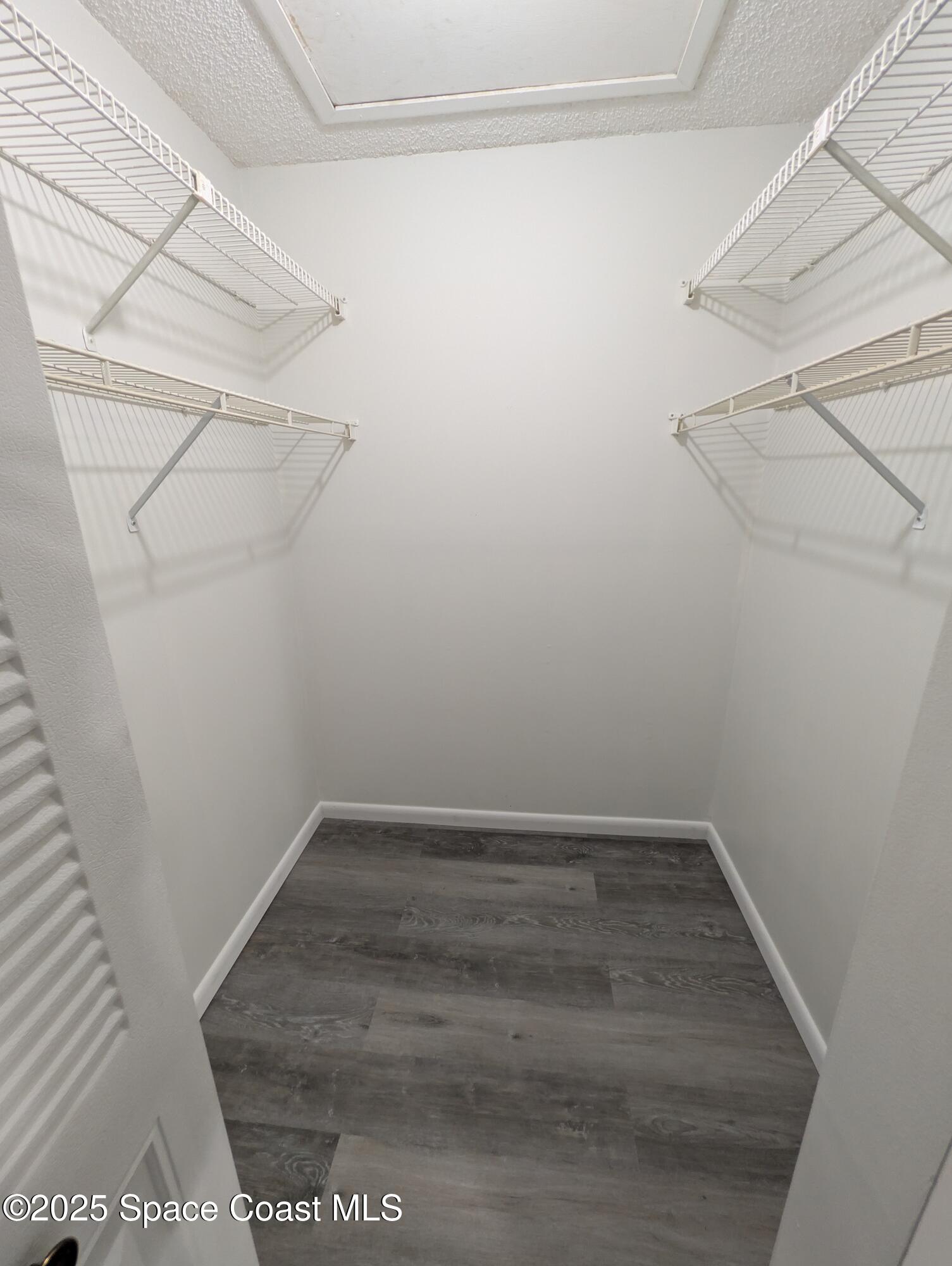 4801 Sisson Road Titusville, FL 32780 - Photo 18 of 21 a view of a room with racks on the wall