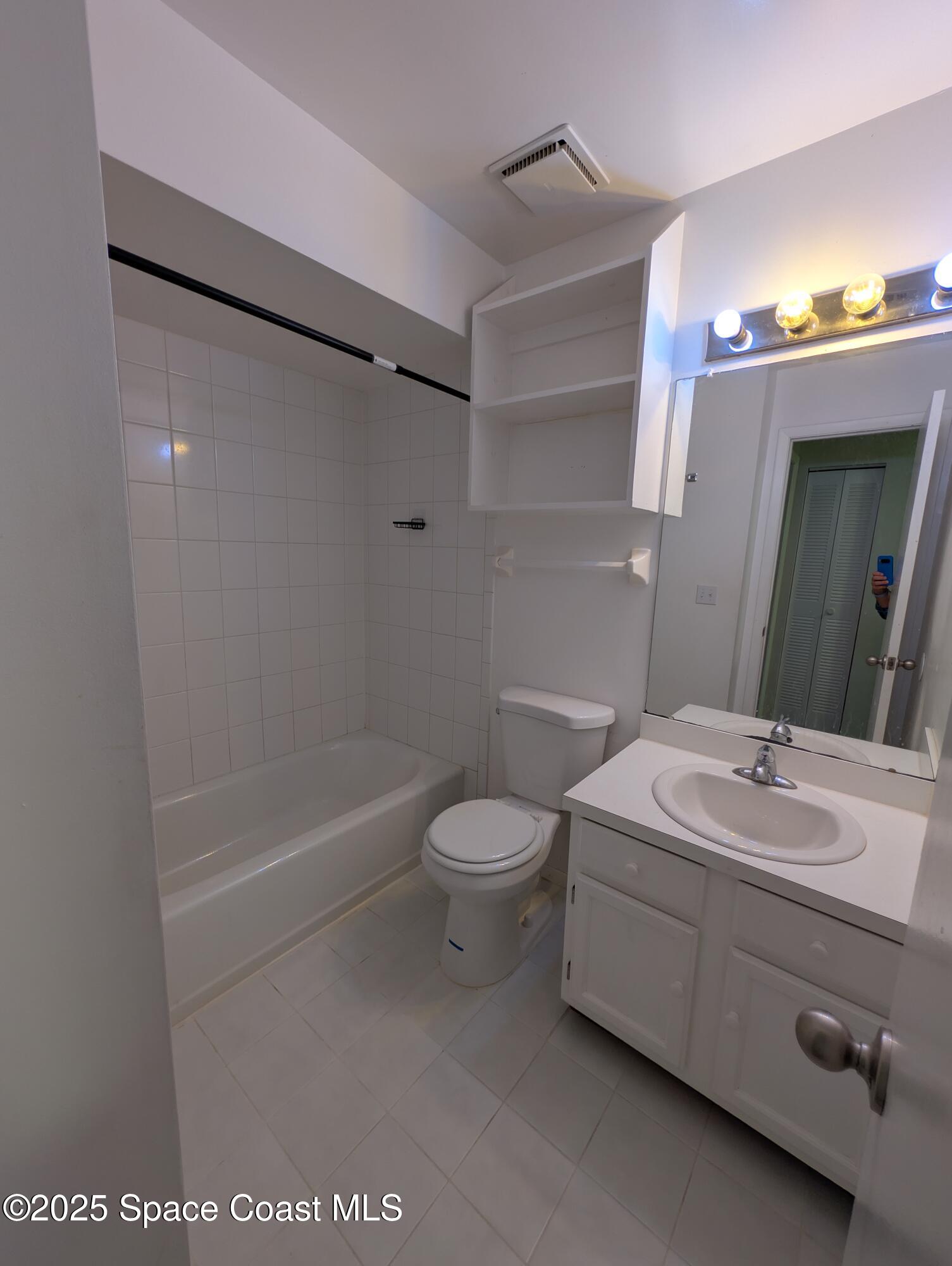 4801 Sisson Road Titusville, FL 32780 - Photo 19 of 21 a bathroom with a sink a toilet and shower