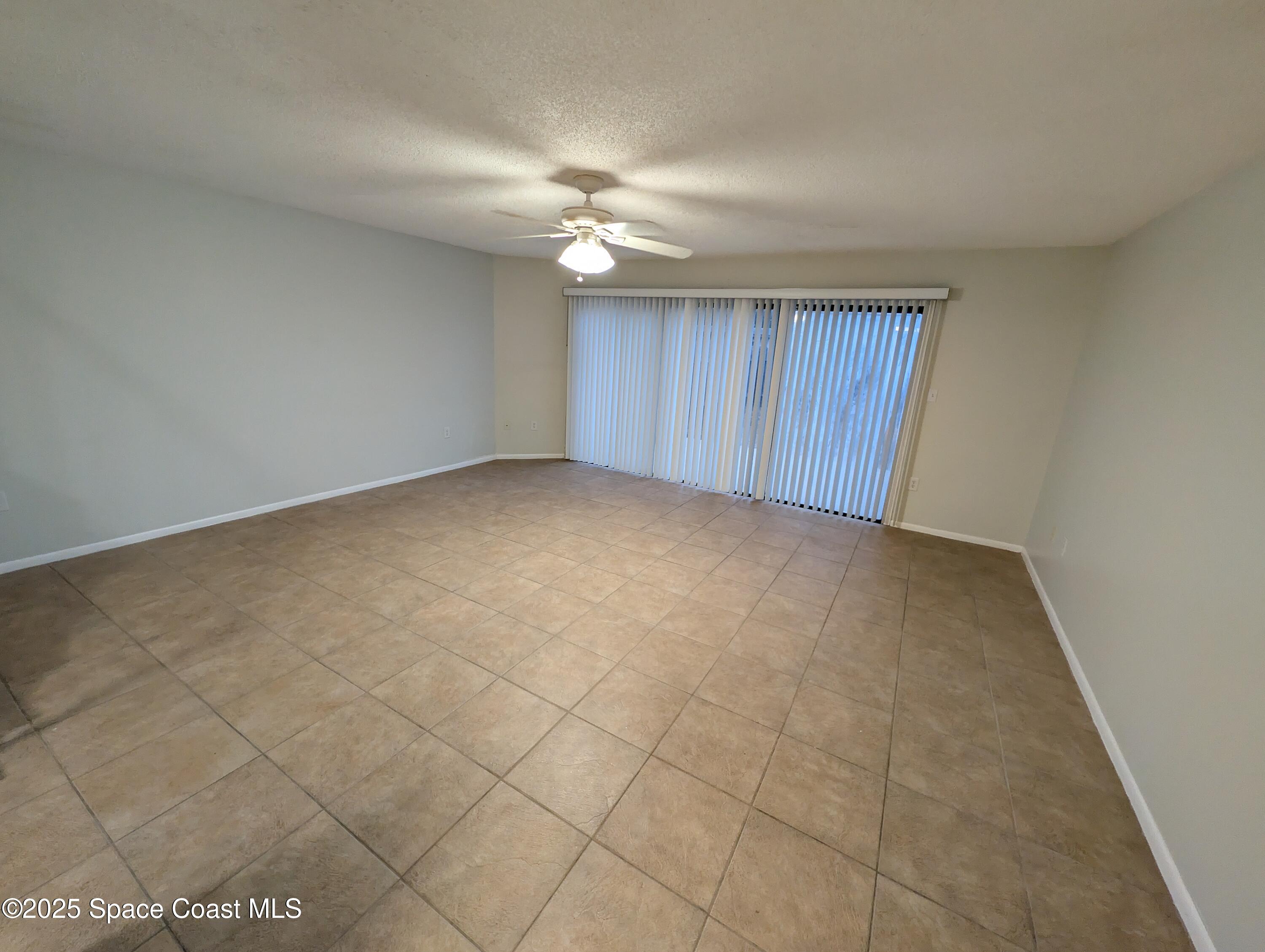 4801 Sisson Road Titusville, FL 32780 - Photo 9 of 21 a view of an empty room and a window