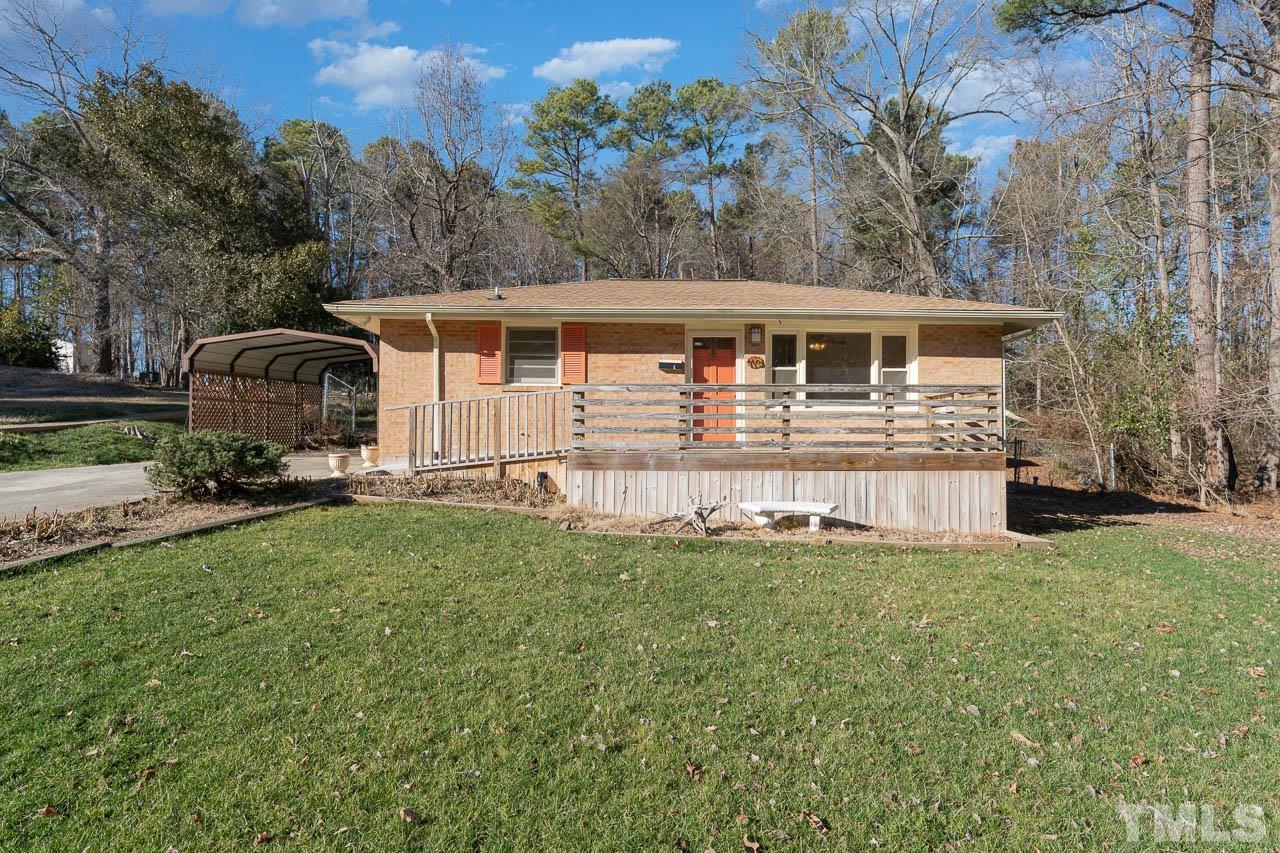 113 Glosson Circle Carrboro, NC 27510 - Photo 1 of 7 a front view of a house with a garden