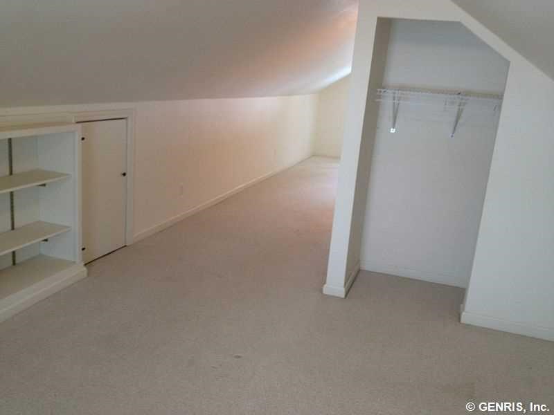 15 Maple Street Pittsford, NY 14534 - Photo 12 of 24 Second floor bedroom with built in shelves