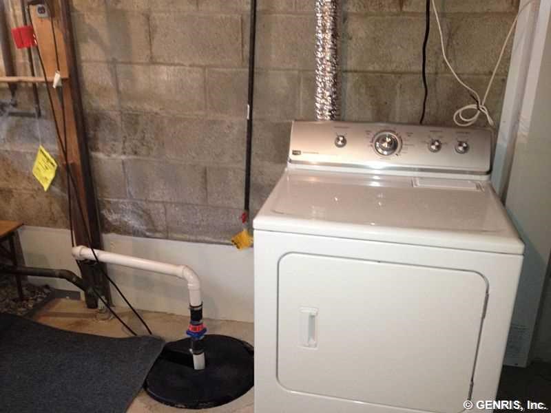 15 Maple Street Pittsford, NY 14534 - Photo 19 of 24 Submerged sump pump. Verticle panel next to dryer