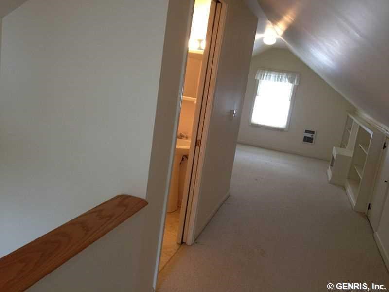 15 Maple Street Pittsford, NY 14534 - Photo 10 of 24 hall and half bath leading to 2nd floor bedroom