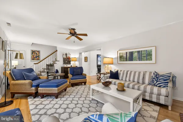 a living room with furniture and a rug