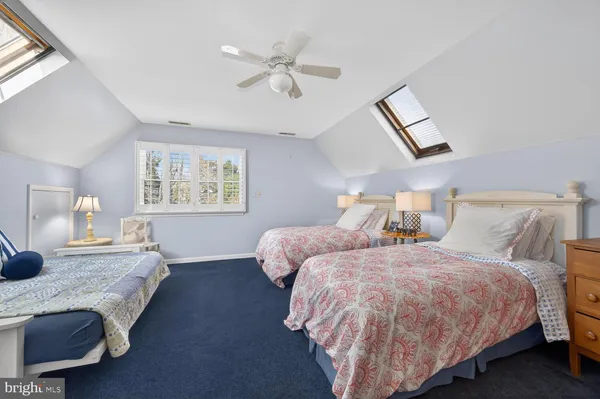 a bedroom with bed and window