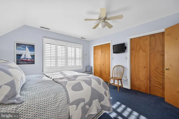 a bedroom with a bed and dresser