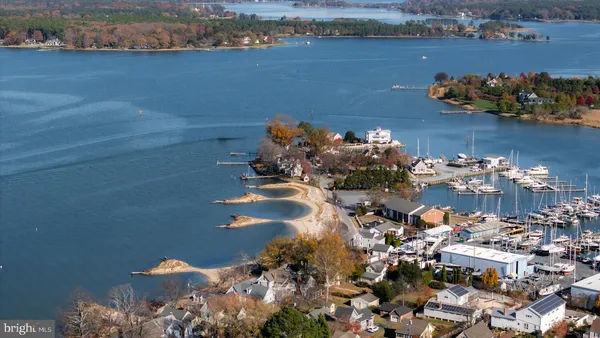 an aerial view of a house with a lake view