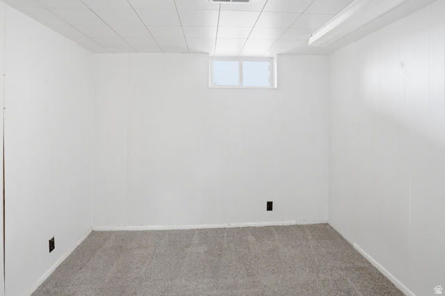 774 37th Street South Ogden, UT 84403 - Photo 21 of 47 Finished room featuring neutral carpeting, white paneling walls, a drop ceiling, and a high window